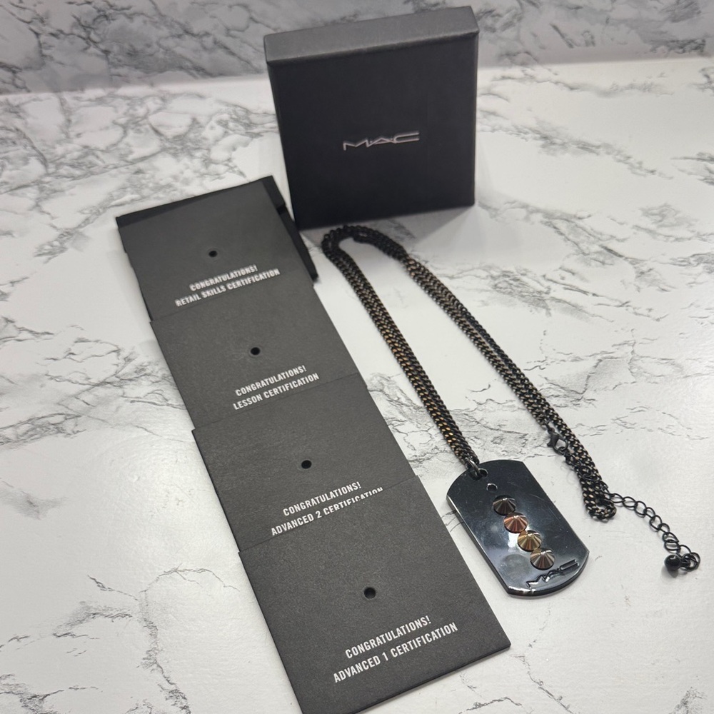MAC certification necklace
Worn for work 
Some scratches but great condition